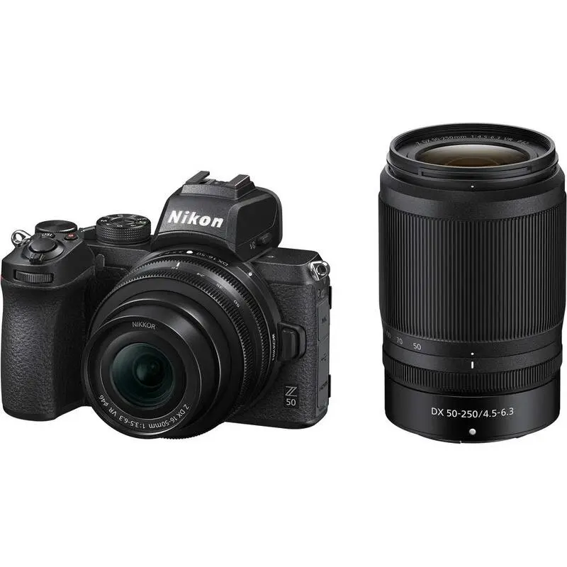 A black Nikon Z50 mirrorless camera with 16-50mm lens placed along 50-250mm lens.